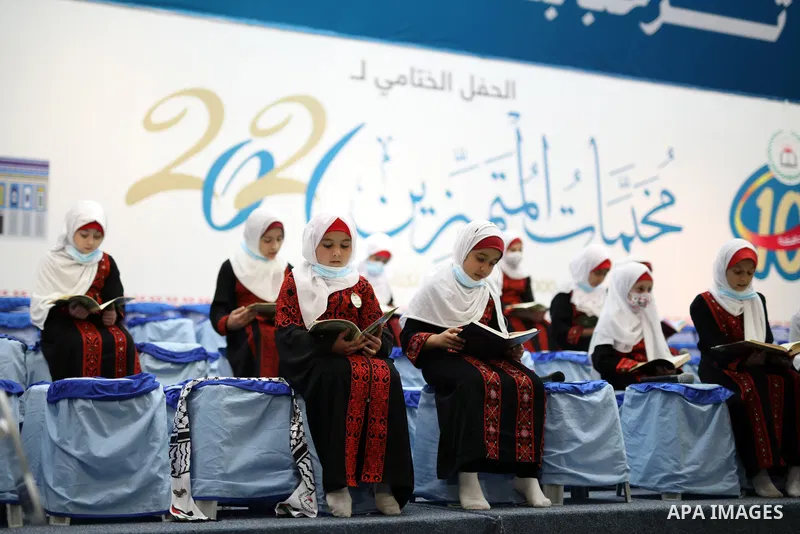 Palestinians participate in a ceremony to honor more than of 500 of memorizers of the Holy Koran, in Islamic Unversity of Gaza (IUG) in Gaza city on October 31, 2021. Photo by APA