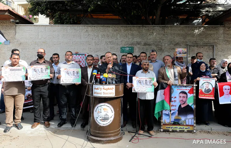 Palestinians take part in a protest in solidarity with prisoners on hunger strike at Israeli jails, in front of Red Cross office in Gaza city on November 1, 2021. President Mahmoud Abbas has asked the head of the Palesti...