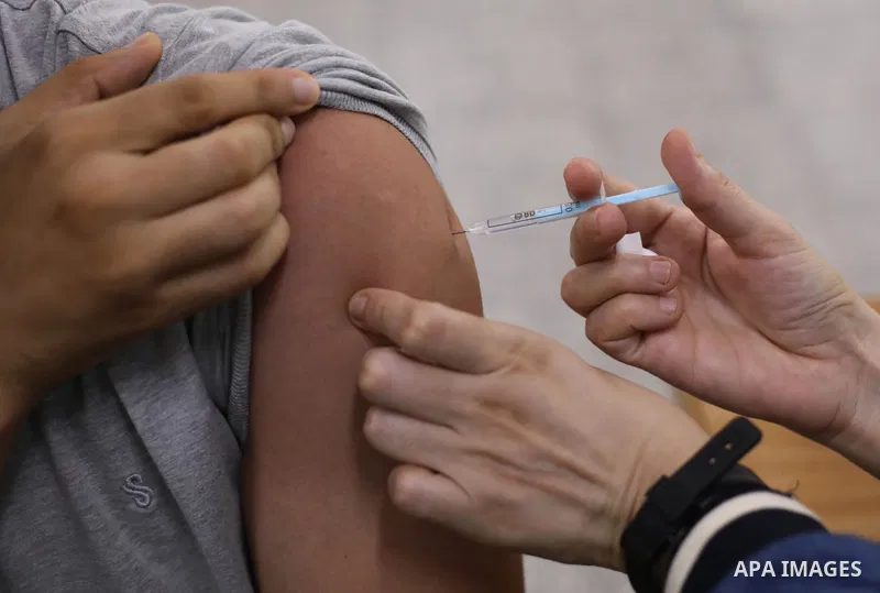 Palestinian students get inoculated with a dose of the Covishield vaccine against the Covid-19 coronavirus, at a school, in Nuseirat refugee camp in central Gaza Strip, on September 1, 2021. Palestinian health authoritie...
