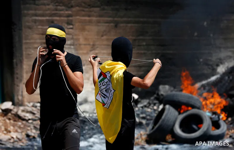 Palestinian protesters clash with Israeli forces following a weekly demonstration against Israeli settlement in the West Bank village of Kfar Qaddum, on September 3, 2021. Photo by Stringer