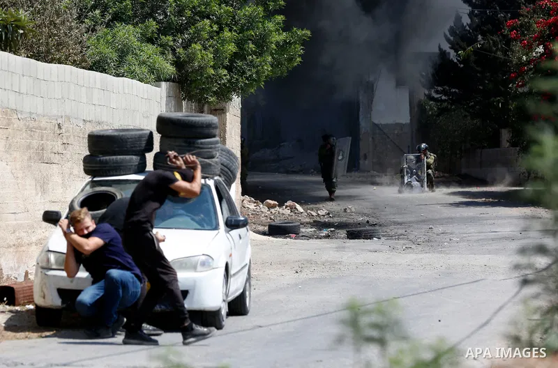 Palestinian protesters clash with Israeli forces following a weekly demonstration against Israeli settlement in the West Bank village of Kfar Qaddum, on September 3, 2021. Photo by Stringer