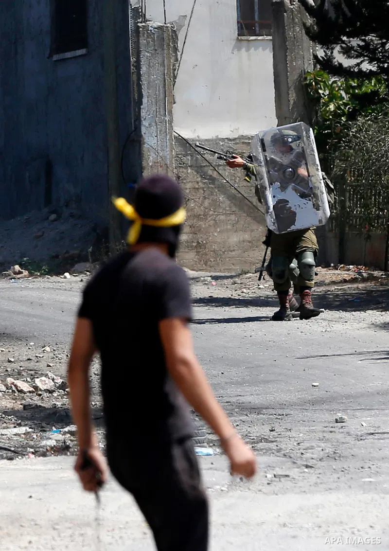 Palestinian protesters clash with Israeli forces following a weekly demonstration against Israeli settlement in the West Bank village of Kfar Qaddum, on September 3, 2021. Photo by Stringer