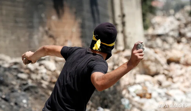Palestinian protesters clash with Israeli forces following a weekly demonstration against Israeli settlement in the West Bank village of Kfar Qaddum, on September 3, 2021. Photo by Stringer