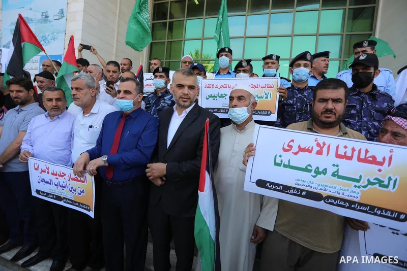 Palestinians take part in a protest to show solidarity with prisoners held in Israeli Jails, in Khan Younis in the southern of Gaza strip, on September 8, 2021. In a step seen as vengeance following the escape yesterday...