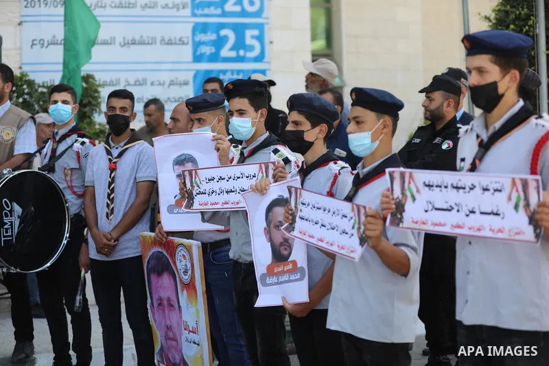 Palestinians take part in a protest to show solidarity with prisoners held in Israeli Jails, in Khan Younis in the southern of Gaza strip, on September 8, 2021. In a step seen as vengeance following the escape yesterday...