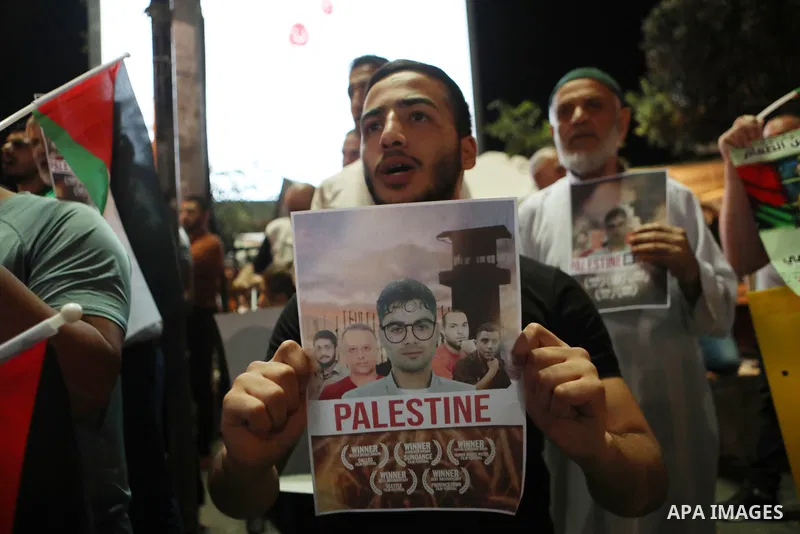 Demonstrators take part in a rally in support of Palestinian prisoners held in Israeli jails, in the West Bank city of Hebron, on September 8, 2021. - Six Palestinians broke out of the Israeli Gilboa prison on September...