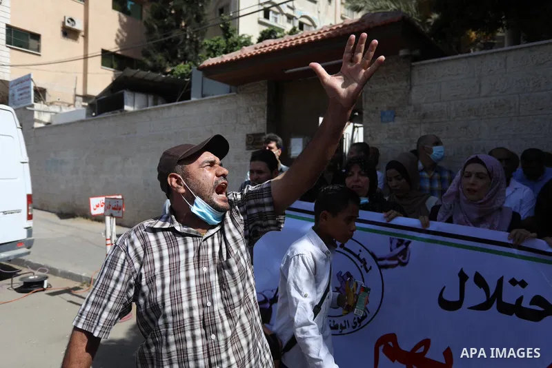 Palestinians take part in a protest in support of prisoners held in Israeli jails, in front of Red cross in Gaza city, September 9, 2021. In a step seen as vengeance following the escape yesterday of six Palestinian resi...