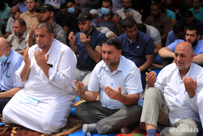 Palestinians attend Friday prayer in solidarity with prisoners in Israeli jails, in front of Red cross office, in Gaza city, on September 10, 2021. Israeli troops have arrested at least six family members in the West Ban...