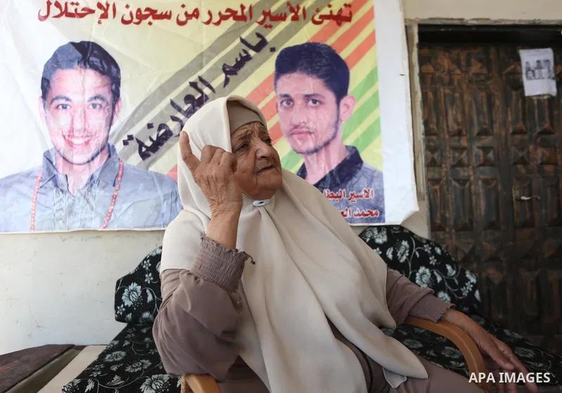 The mother of the Palestinian Mohammed Arda, who was arrested following his escape from Gilboa prison, sits in his family house in the West Bank city of Jenin on 11 Sebtember 2021. Two more of the six Gilboa prison freed...
