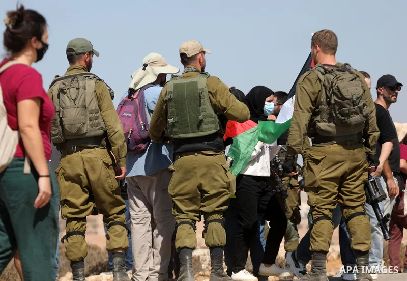 Palestinians and foreign activists demonstrate against Israeli confiscation and the cutting water supply for Palestinians villages, in the southern area of the West bank town of Hebron, on September 17, 2021. Photo by Ma...