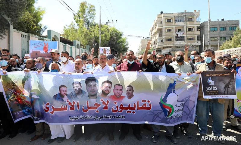 Palestinians take part in solidarity with prisoners in Israeli jails in Gaza city on September 19, 2021. Israeli forces last night captured Ayham Kamamji and Munadel Nufei’at, the last Palestinian freedom fighters to rem...