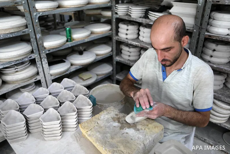 Palestinians work at the ceramics industry, in the Old City in West Bank city of Hebron, on September 19, 2021. Hebron’s ceramics are internationally known for their distinct style and careful, creative finishing touches...
