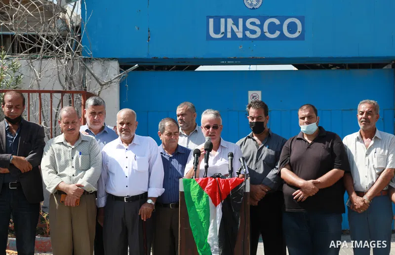 Palestinians attend a press conference, in front of the UNESCO headquarters in Gaza City on September 20, 2021. The Follow-up Committee of the National and Islamic Forces published a letter on Monday addressed to the Sec...
