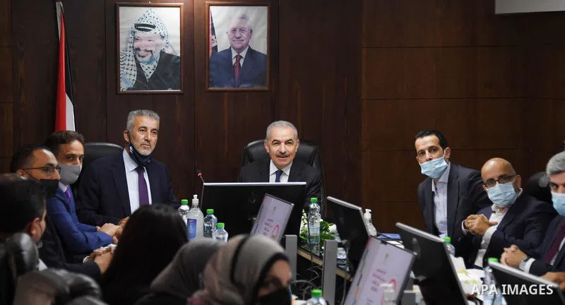 Palestinian Prime Minister Mohammed Ishtayeh meets with Minister of Local Government Majdi Al-Saleh, in the West Bank city of Al-Bireh on September 21, 2021. Photo by Prime Minister Office