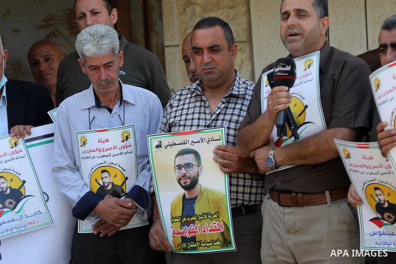 Palestinians take part in a protest to solidarity with prisoners held in Israeli jalis, in the West Bank city of Hebron on September 21 2021. There are around 4,850 Palestinian detainees in Israeli prisons, including 41...