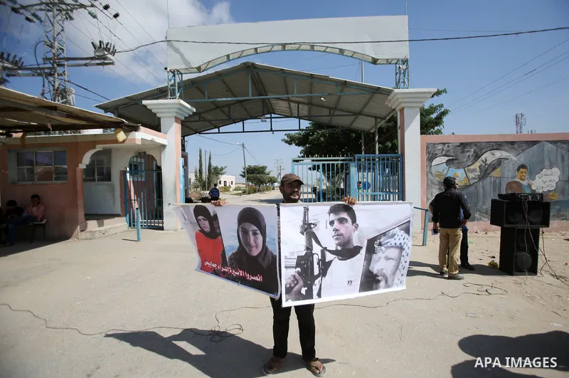 Palestinian supporters of Islamic Jihad, take part in a protest to show solidarity with prisoners in Israeli Jalis, in front of Erez crossing in Beit Hanoun in the northern Gaza Strip, on September 22, 2021. There are ar...