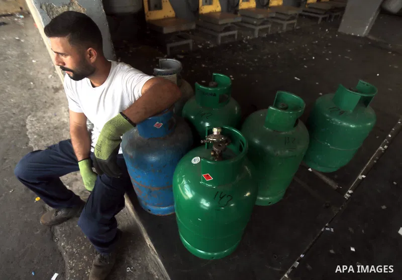 Lebanese wait to fill their gas cylinders amidst a deepening economic crisis, at a gas stationin Beirut, Lebanon, on September 22, 2021. The technical problem forced most gas stations to shut down, despite the long queue...