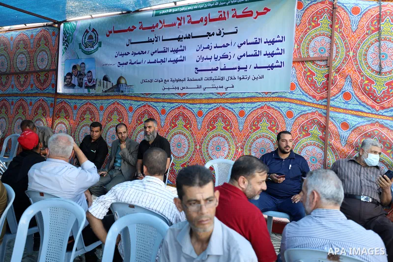 Palestinians take part in a mourning tent of five Palestinians killed by Israeli forces, in Gaza city on September 26, 2021. An Israeli operation to dismantle a Hamas Islamist cell in the West Bank sparked fierce gun bat...