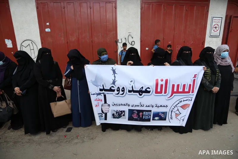 Palestinians take part in a protest to show solidarity with prisoners in Israeli Jails, in front of Red cross office in Khan Younis in the southern of Gaza strip, on Sebtember 27, 2021. Palestinian administrative detaine...