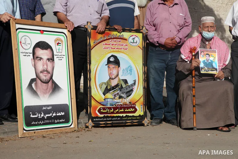 Palestinians take part in a rally demanding to return the bodies of Palestinians who killed by Israeli army and detained them, in front of Red Cross office in Gaza city, on August 29, 2021. Palestinians mark the National...