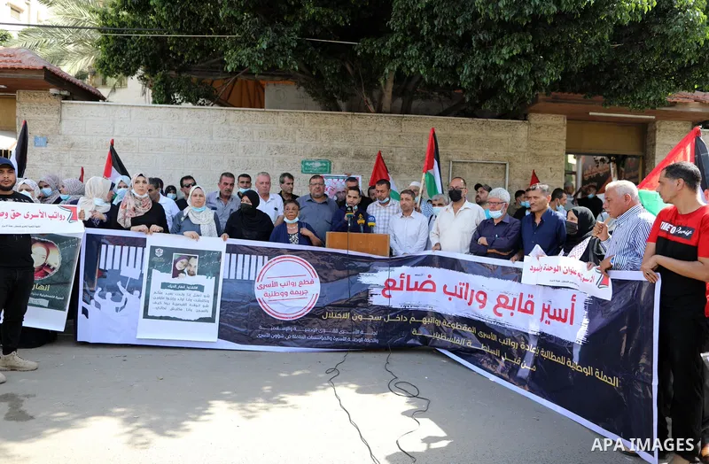 Palestinians take part in a protest to show solidarity with prisoners in Israeli Jails, in front of the headquarters of Red cross, in Gaza city, on August 30, 2021. There are around 4,850 Palestinian detainees in Israeli...