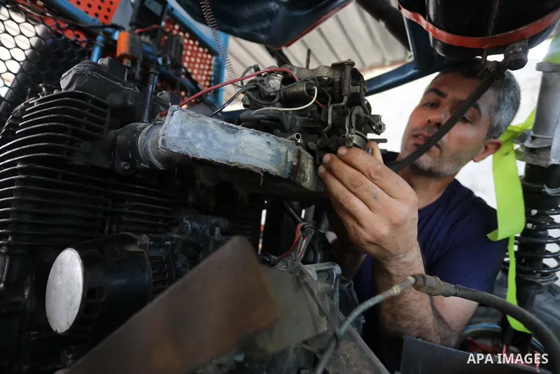 Palestinian Fathi Abu Gharaba, 46, invents a racing car in Maghazi refugee camp in the central Gaza Strip, on July 31, 2021. Using scrap materials and rudimentary equipment at a cost of US$3500, Abu Gharaba produces a "d...