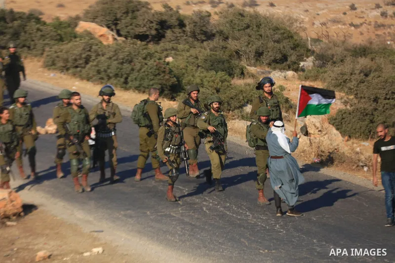Israeli soldiers clash with Palestinian protesters near a previously-evacuated Israeli army camp that was taken over by settlers, at Tayasir checkpoint east of Tubas in the north of the occupied West Bank, on July 31, 20...
