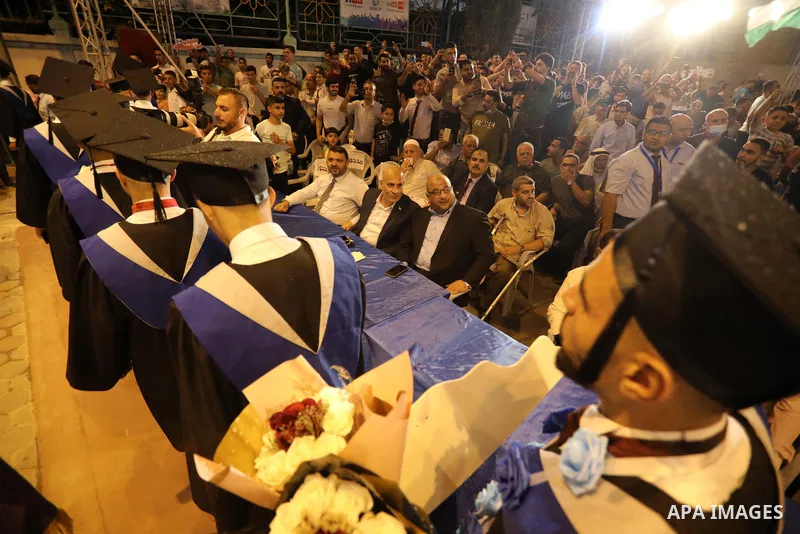 A picture taken on August 1, 2021 shows Zakaria Muammar, a member of the Hamas political bureau, attends graduation ceremony at University College of Applied Sciences (UCAS), in Gaza city. Photo by Ashraf Amra