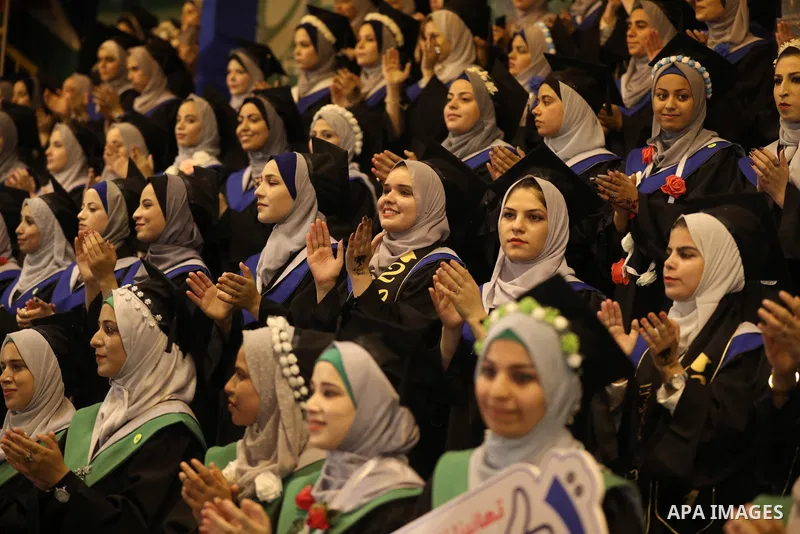 A picture taken on August 1, 2021 shows Palestinian students attend their graduation ceremony at University College of Applied Sciences (UCAS), in Gaza city. Photo by Ashraf Amra