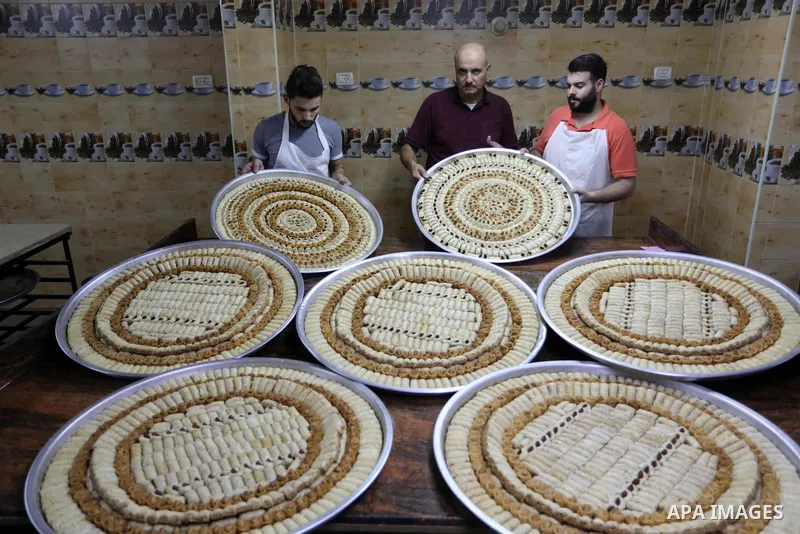 Palestinian vendors prepare sweets a day before high school exams "Tawjihi" results at a factory in Gaza city on August 2, 2021. The Ministry of Education in the West Bank and Gaza Strip announced that high school result...