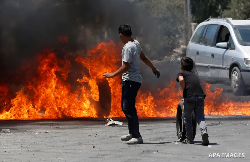 Palestinian protesters clash with Israeli forces in Beita village near the West Bank city of Nablus on August 2, 2021. Photo by Stringer