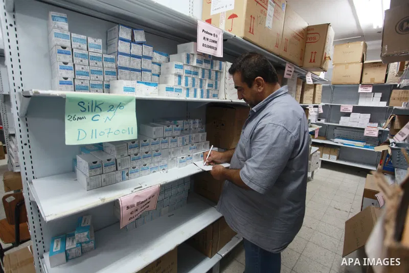 Employees of the Palestinian Ministry of Health in the Gaza Strip count the missing medicines due to Israel's continued closure of the border crossings, inside the warehouses of the Ministry of Health in Gaza City, on Au...