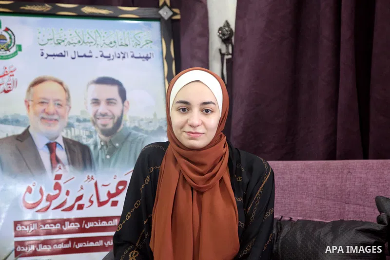 A Palestinian high school students Sara al-Zebda, who her father and brother killed during the recent conflict between Israel and Hamas, celebrates with her family after her success in the final exams known as "Tawjihi",...