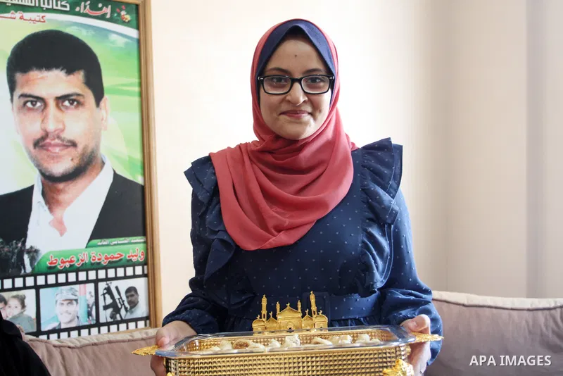 A Palestinian high school female student, Bahia Al-Zaa'boot, 94.1%, celebrates with her family after shes success in final exams known as ''Tawjihi'', in Gaza city on August 4, 2021. Photo by Omar Ashtawy