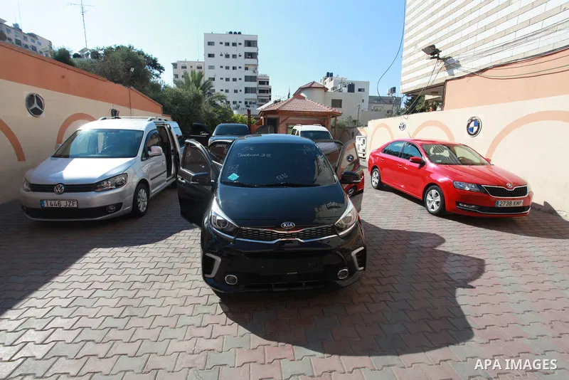 New cars are seen at a car show place amid Israel's import ban in Gaza city, on August 4, 2021. Palestinian traders and citizens of the besieged Gaza Strip complain of a "fatal stagnation" in the car trading amid an impo...