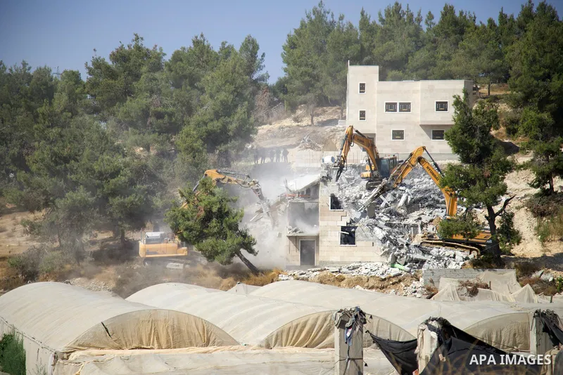 Israeli excavators demolish Palestinian-built houses in the village of Sair northeast of Hebron on August 5, 2021, which according to Israel were built without authorisation in "Area C" of the West Bank where Israel reta...