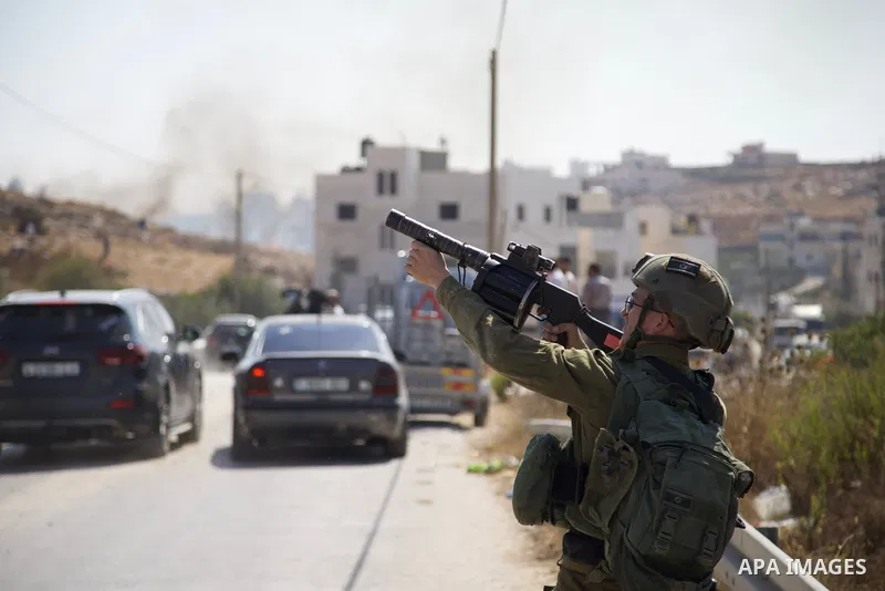 Israeli border guards fire rubber bullets and tear gas during clashes with locals in the village of Sair northeast of Hebron in the occupied West Bank on August 5, 2021, during demolitions of Palestinian-built buildings...