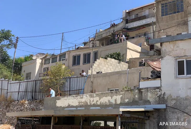 Israeli forces demolish a Palestinian building in the East Jerusalem neighborhood of Silwan, on August 10, 2021. The owners of the two-story building were identified as Remah Odeh, and his brother, Ali, whose families co...