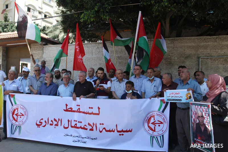 Palestinian supporters of the Popular Front for the Liberation of Palestine, take part in a protest to show solidarity with prisoners on hunger strike in Israeli Jails, in front of the headquarters of Red cross in Gaza c...