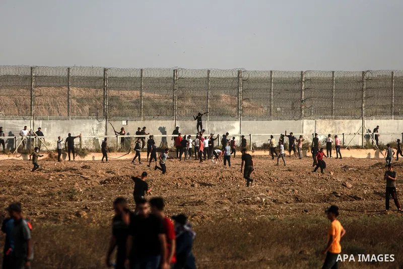Palestinians clash with Israeli security forces following a demonstration along the Israel-Gaza border, east of Gaza City, denouncing the Israeli siege of the Palestinian strip, on August 21, 2021. Today, Saturday marks...