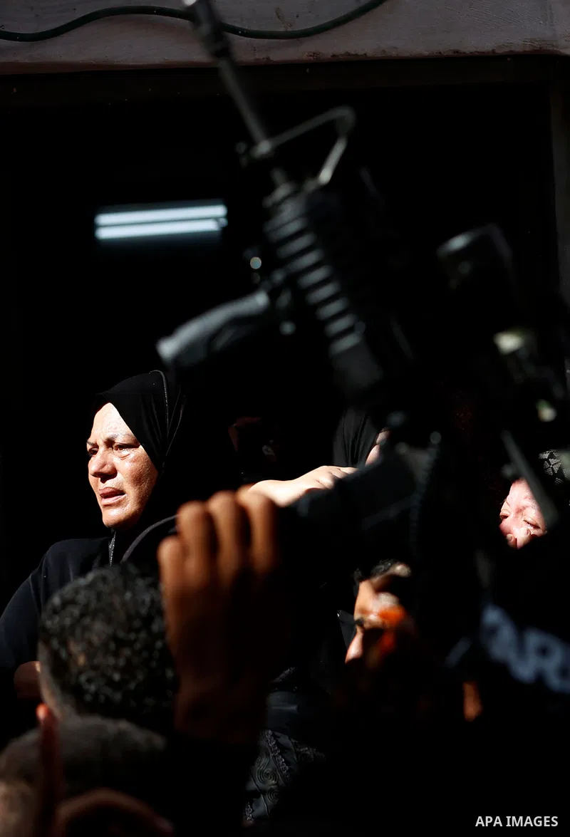 Palestinians attend the funeral of 15-year-old Palestinian Imad Khaled Saleh Hashash at the Balata refugee camp, in the north of the West Bank on August 24, 2021. The Palestinian teenager was killed by Israeli fire early...