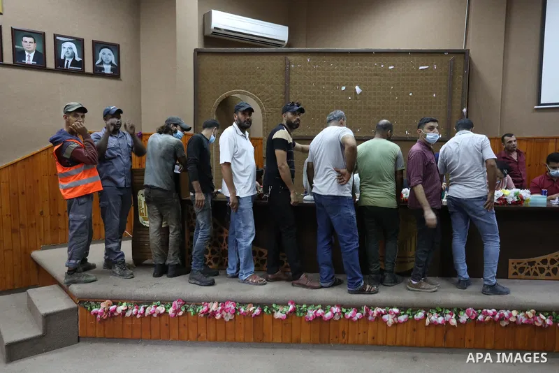 Palestinians get inoculated with a dose of the Covishield vaccine against the Covid-19 coronavirus, at a temporary vaccination centre set up, in Deir Al Balah in the center of Gaza strip on August 26, 2021. Minister of H...