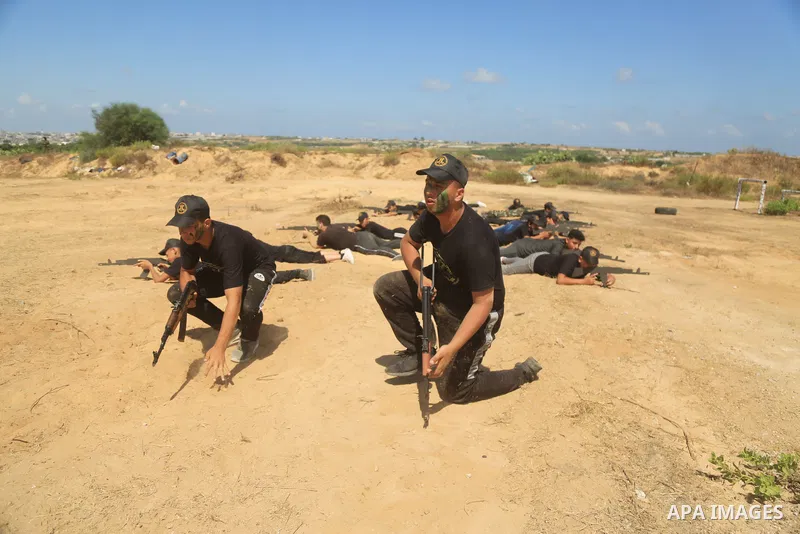 Young Palestinians take part in a military summer camp organised by the Islamic Jihad Movement, in Gaza City on July 04, 2021. Photo by Dawoud Abo Alkas