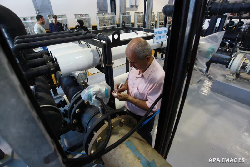 Palestinian workers work inside a water desalination plant in Gaza City on July 06, 2021. The Gaza Strip suffers from an acute lack of water for human and agricultural use. Currently, 90 percent of its main water supply...