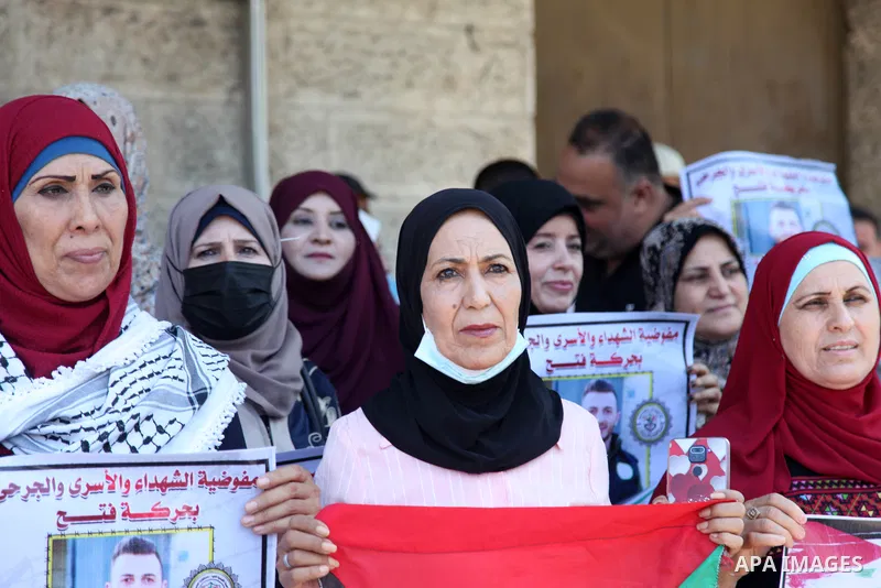 Palestinians take part in a celebration of Ghazanfar Abu Atwan who was released from Israeli Jails, in front of Red Cross office, in Gaza city on July 11 2021. Palestinian prisoner Ghazanfar Abu Atwan has suspended his h...