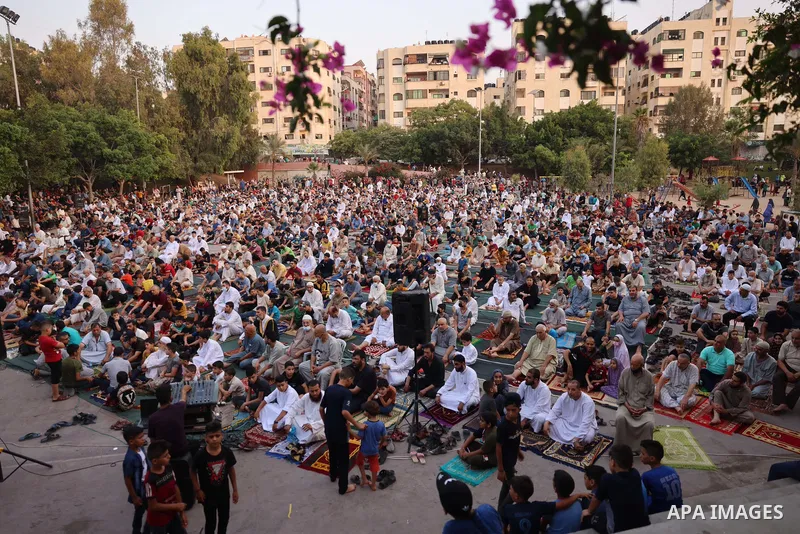Palestinians pray on the first day of Muslim holiday of Eid al-Adha in Gaza city on July 20, 2021. Eid al-Adha, or Feast of Sacrifice, Islam's most important holiday marks the willingness of the Prophet Ibrahim to sacrif...