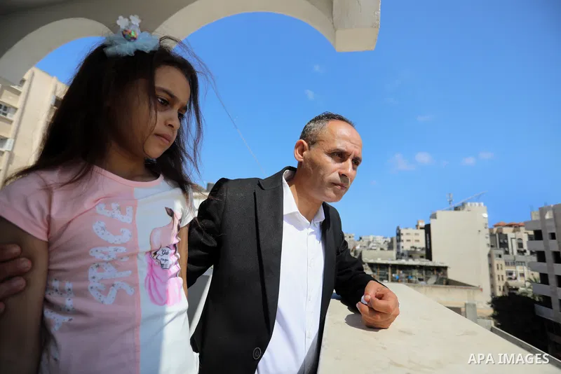 Riad Ishkontana, 42, and his daughter Suzy, 7, in the house of a family member where she is currently living after her house was destroyed in an Israeli airstirke in the recent conflict between Israel and Hamas on May, d...