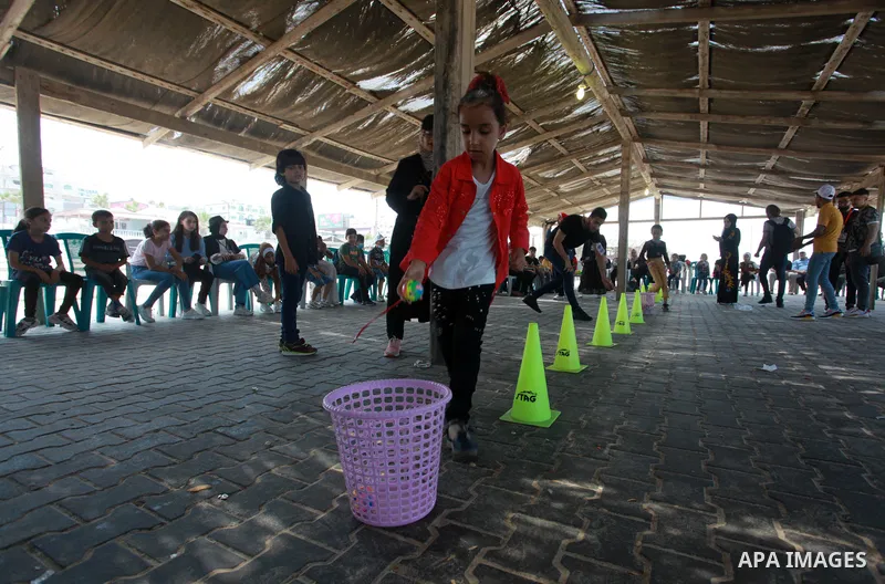 Palestinian refugee children take part in a mental health support session during entertainment festival after the latest Israeli escalation, in Gaza city, on July 24, 2021. Photo by Youssef Abu Watfa