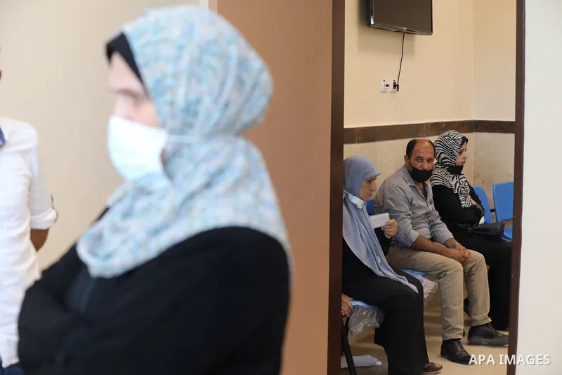 Palestinians receive the dose of the coronavirus disease (COVID-19) vaccine at the UNRWA clininc, in Gaza city on July 27, 2021. A total of 477,027 people have been vaccinated against the coronavirus in the West Bank and...
