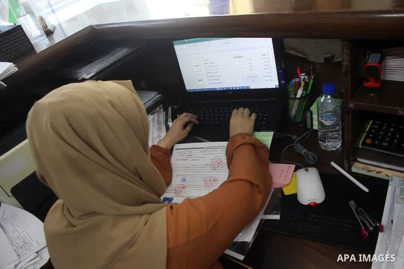 Palestinians work at Post Office in Gaza City after a 50-day closure because of the military conflict between the Israeli army and the Palestinian armed factions, on June 29, 2021. Photo by Marihan Al-Khalidi